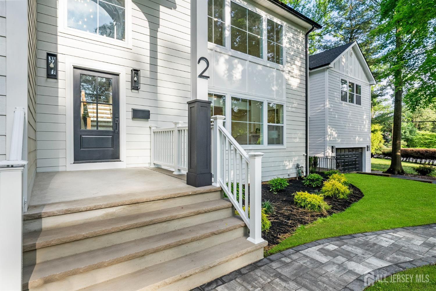 2 Beech Lane Edison, NJ 08820 - Photo 3 of 51 a front view of a house with a garden