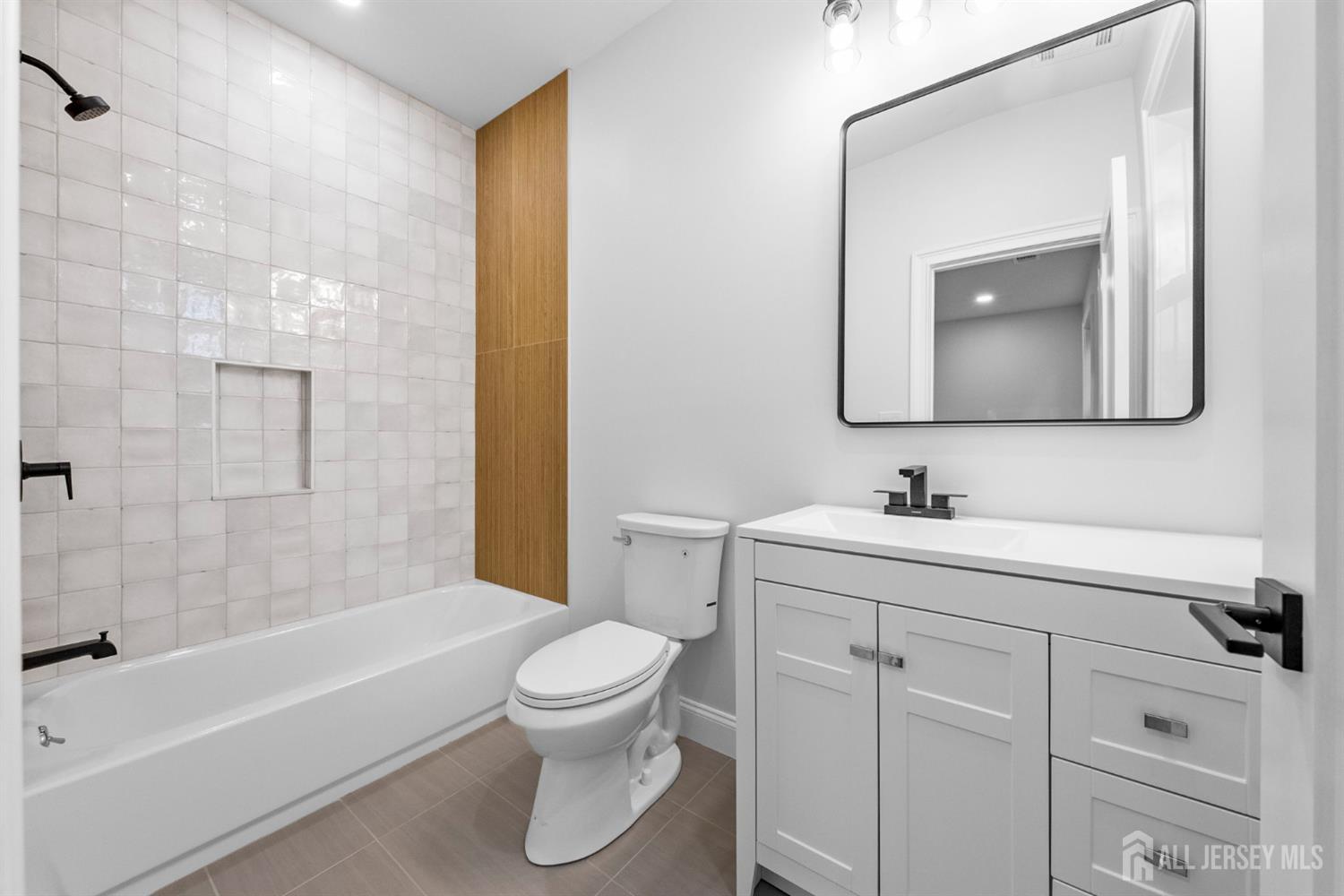 2 Beech Lane Edison, NJ 08820 - Photo 32 of 51 a bathroom with a toilet sink vanity tub and mirror