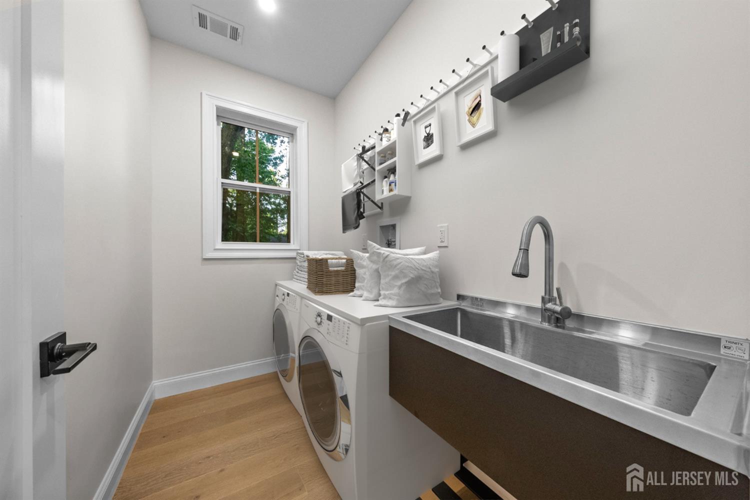 2 Beech Lane Edison, NJ 08820 - Photo 39 of 51 a room with a sink a washer and dryer