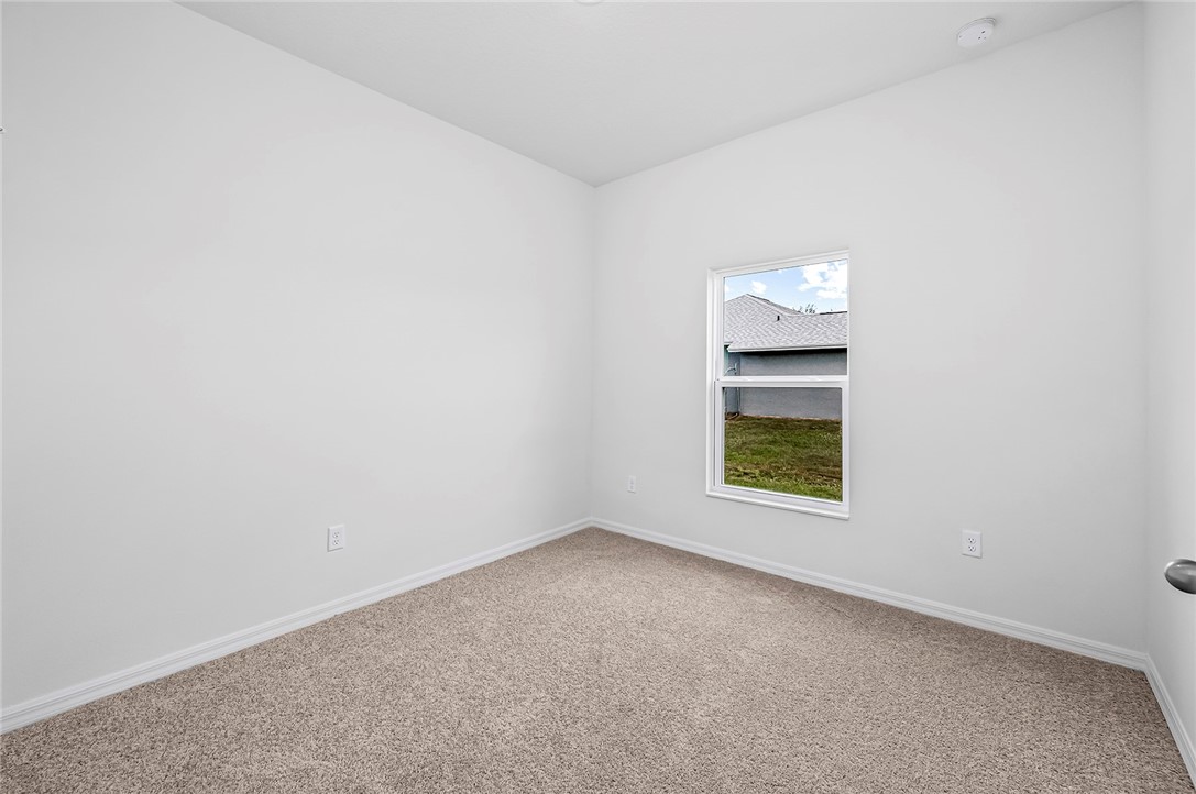 7926 105th Avenue Vero Beach, FL 32967 - Photo 13 of 18 an empty room with a window