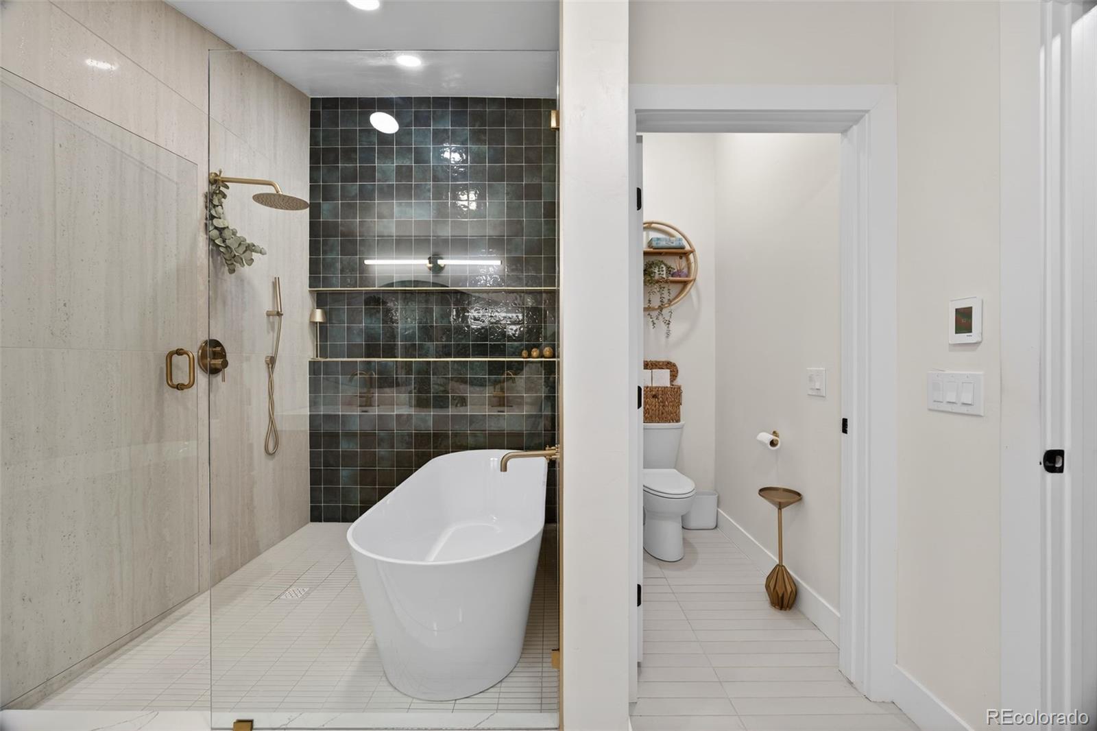 5175 Raleigh Street Denver, CO 80212 - Photo 45 of 49 a bathroom with a shower a toilet and a shower