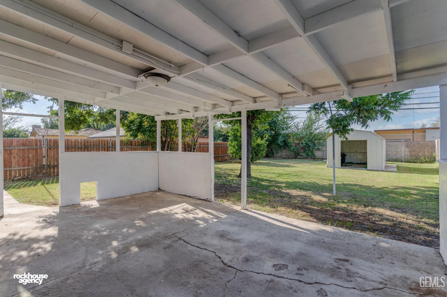 Undisclosed Address Bakersfield, CA 93308 - Photo 14 of 17 a view of a house with backyard and a porch