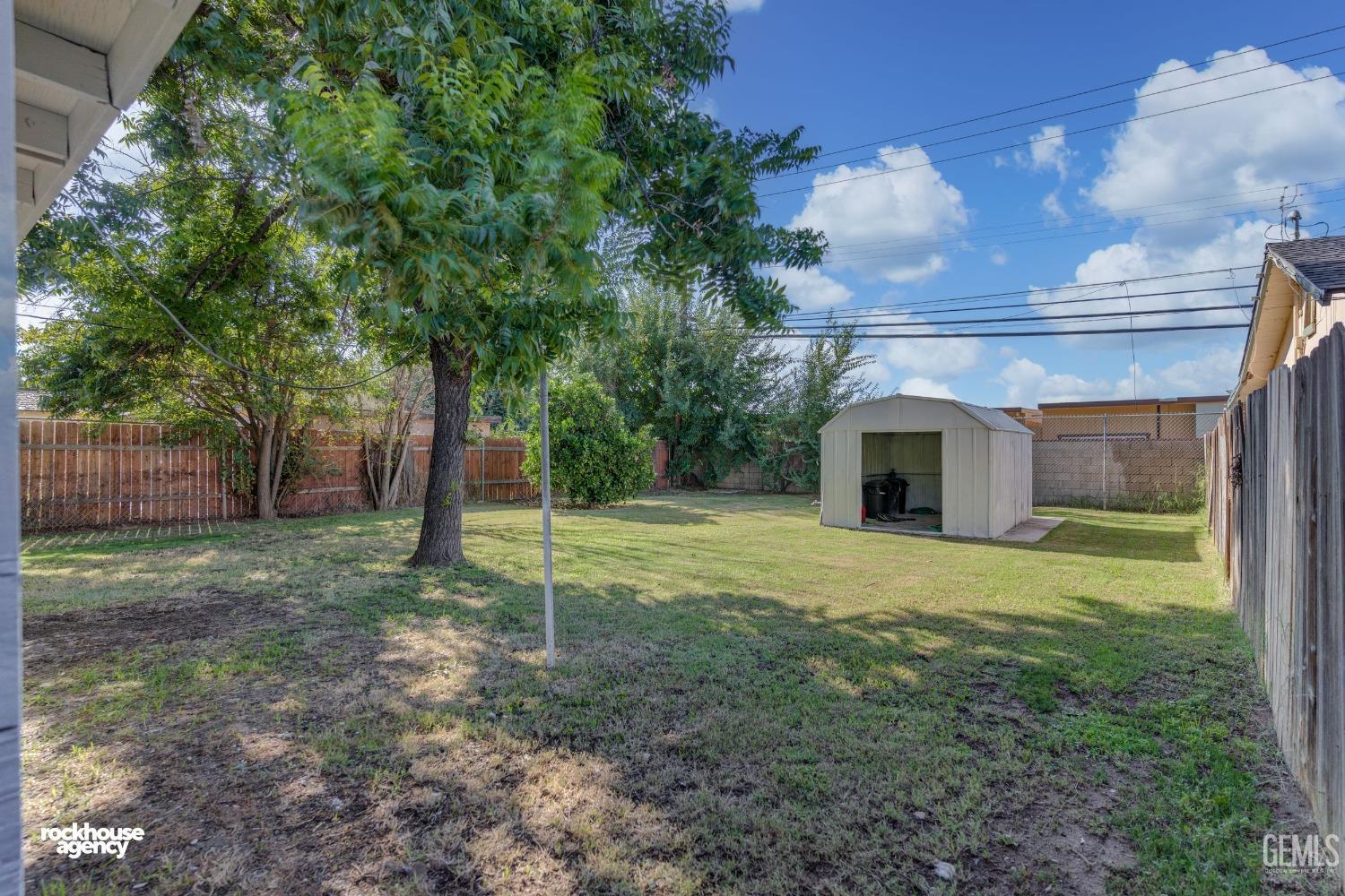 Undisclosed Address Bakersfield, CA 93308 - Photo 15 of 17 a backyard of a house with plants and outdoor space