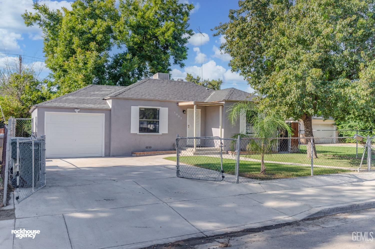 Undisclosed Address Bakersfield, CA 93308 - Photo 17 of 17 a front view of a house with a garden