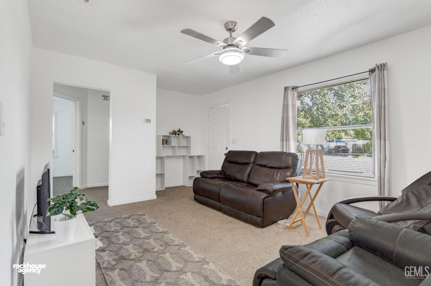 Undisclosed Address Bakersfield, CA 93308 - Photo 4 of 17 a living room with furniture and a large window