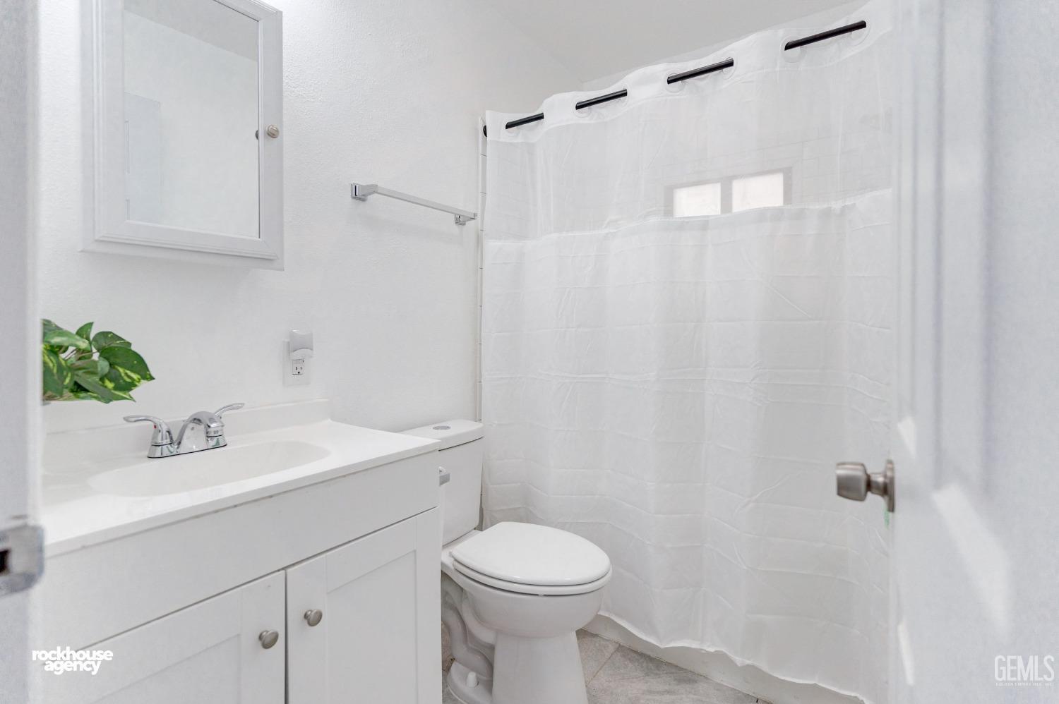 Undisclosed Address Bakersfield, CA 93308 - Photo 9 of 17 a bathroom with a sink a toilet and shower