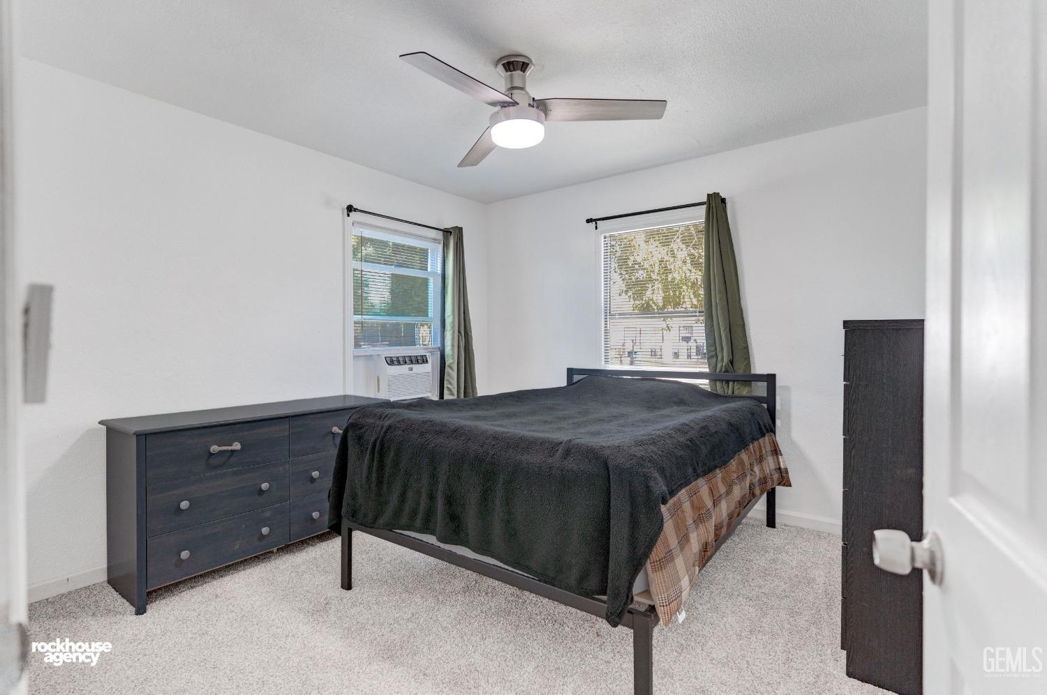 Undisclosed Address Bakersfield, CA 93308 - Photo 10 of 17 a bedroom with a bed and a window