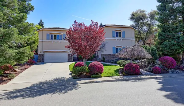 a front view of house with small garden