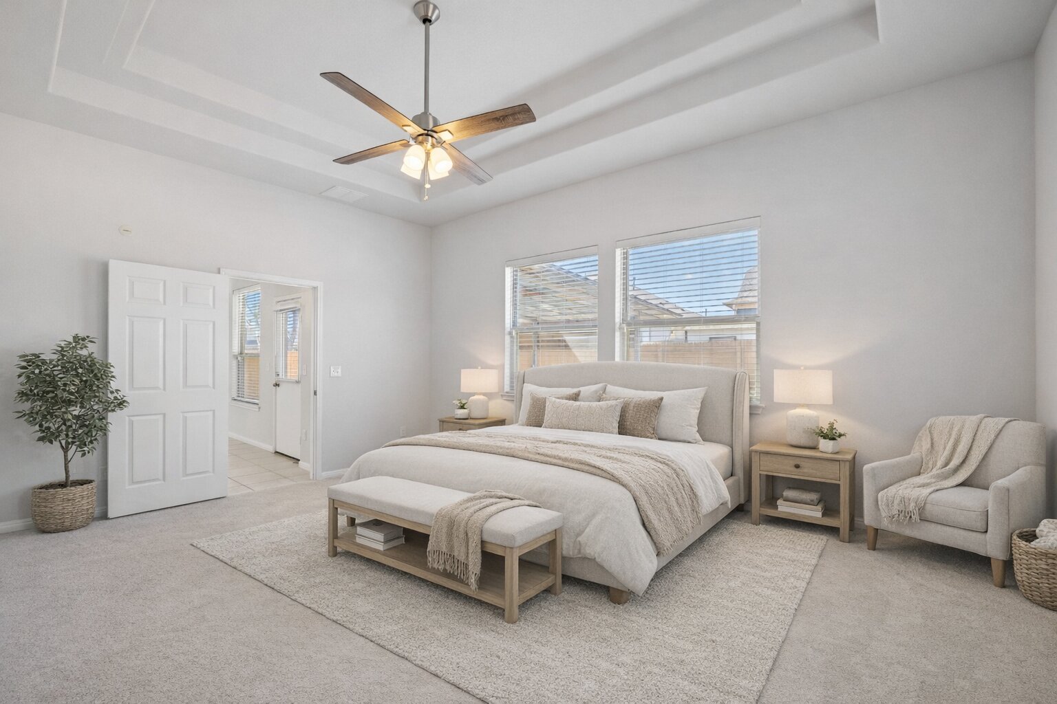 183 Concho Creek Loop Leander, TX 78641 - Photo 17 of 35 a bedroom with a bed and a chandelier