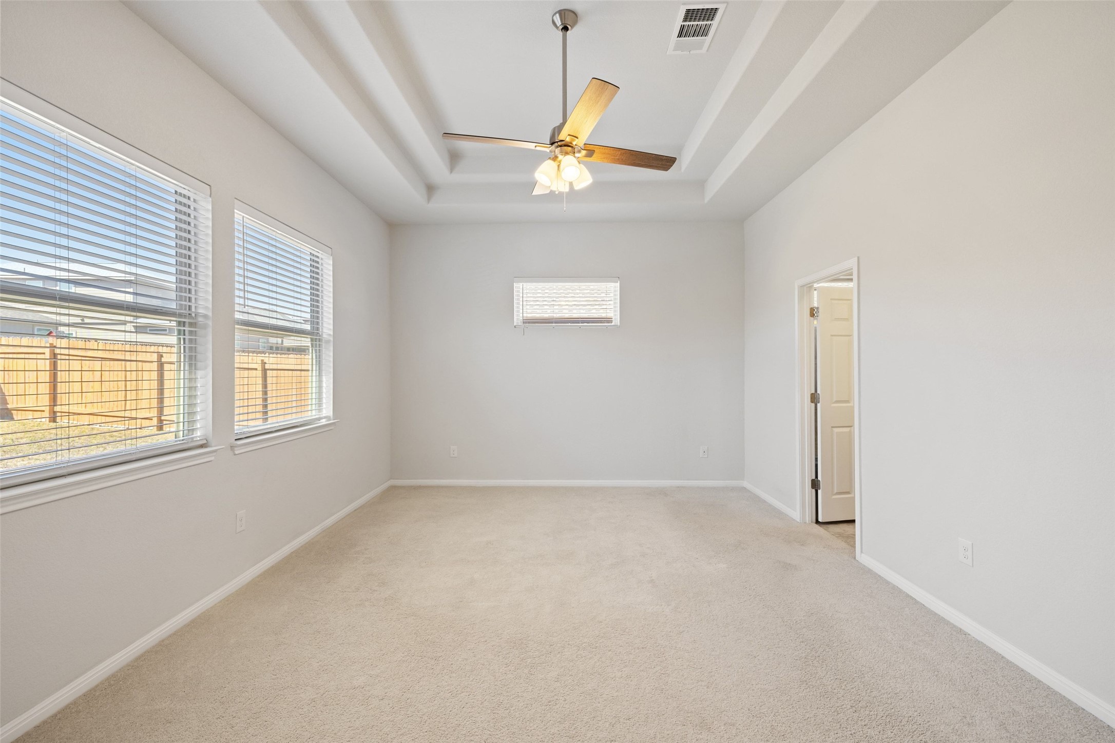 183 Concho Creek Loop Leander, TX 78641 - Photo 19 of 35 an empty room with a window and a ceiling fan