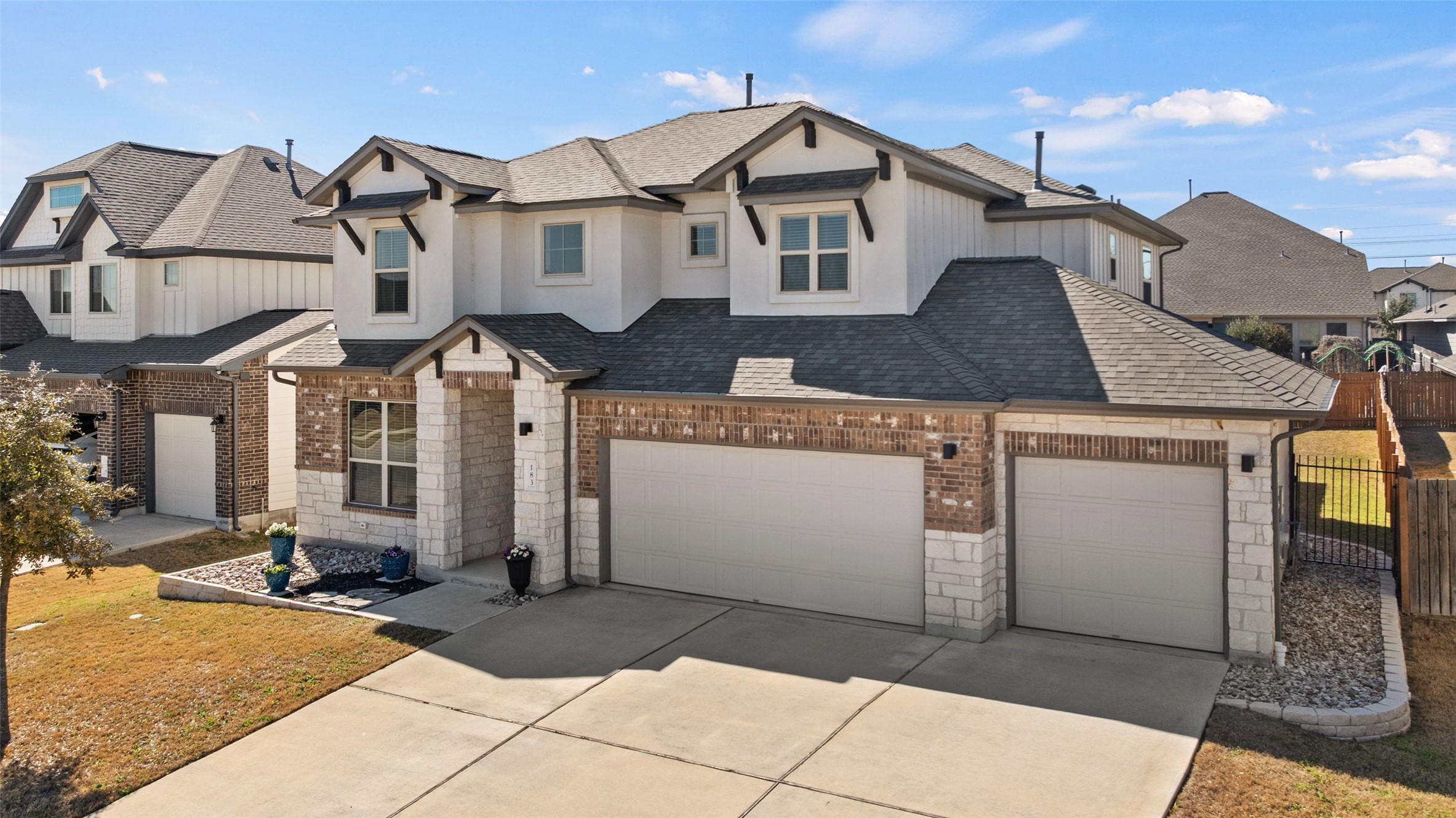 183 Concho Creek Loop Leander, TX 78641 - Photo 2 of 35 a front view of a house with a yard