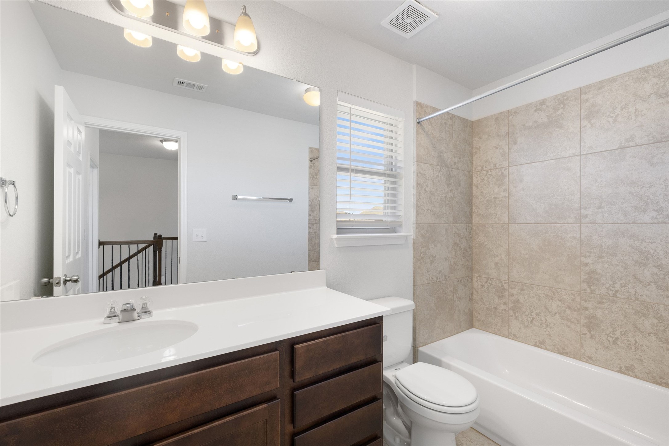 183 Concho Creek Loop Leander, TX 78641 - Photo 26 of 35 a bathroom with a sink a toilet and shower