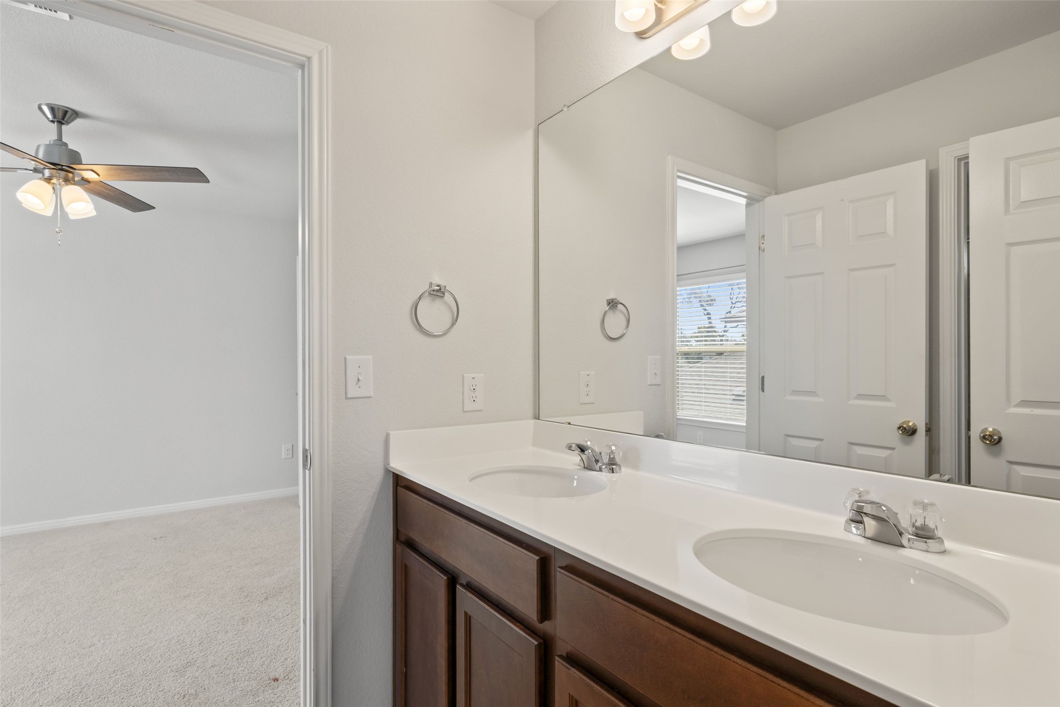 183 Concho Creek Loop Leander, TX 78641 - Photo 28 of 35 a bathroom with a sink and a mirror