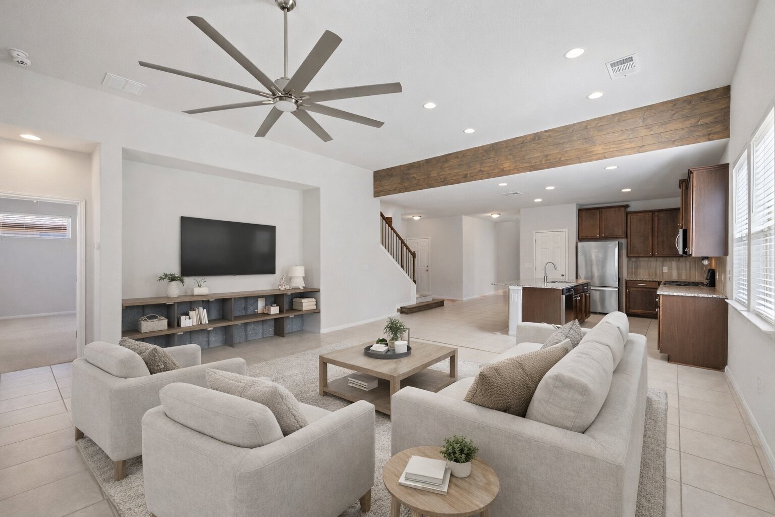183 Concho Creek Loop Leander, TX 78641 - Photo 3 of 35 a living room with furniture and a flat screen tv with wooden floor