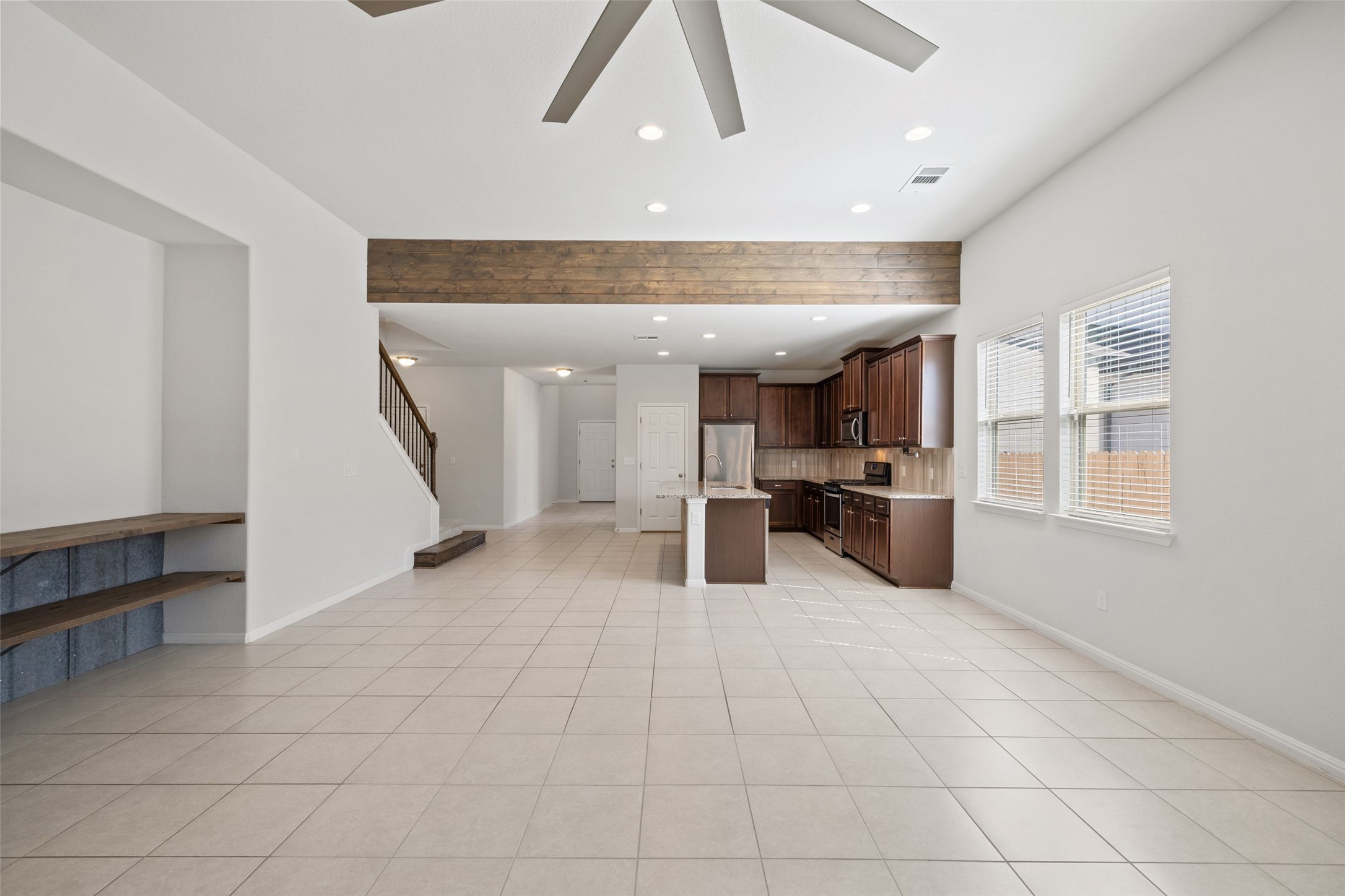 183 Concho Creek Loop Leander, TX 78641 - Photo 6 of 35 a view of a kitchen with furniture and a refrigerator