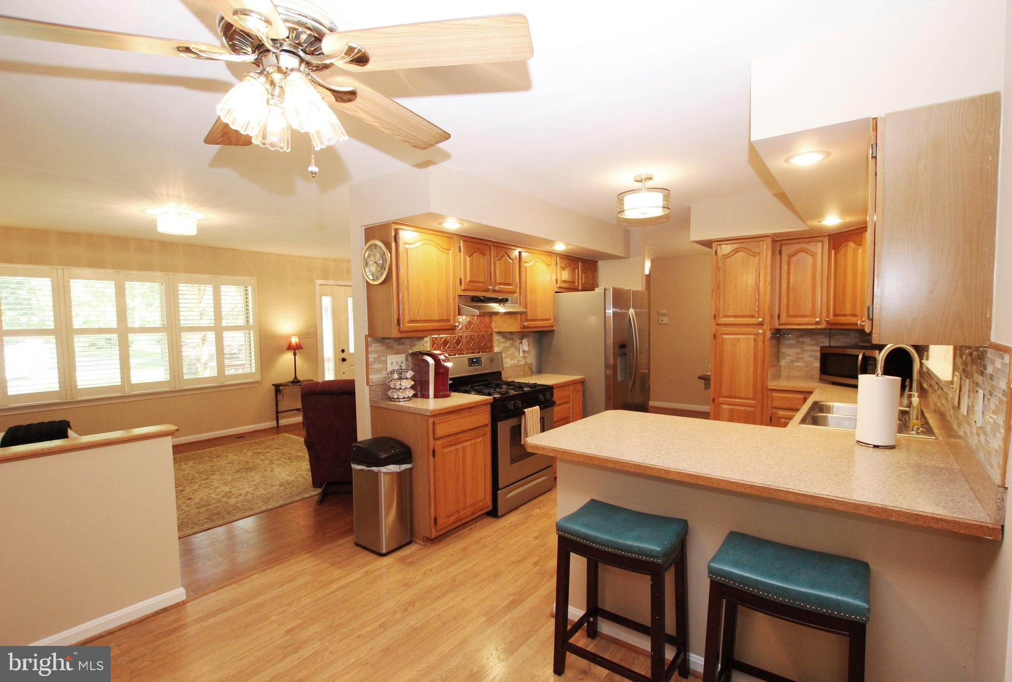 426 Mad Hatter Road Harpers Ferry, WV 25425 - Photo 11 of 31 a large kitchen with a table and chairs