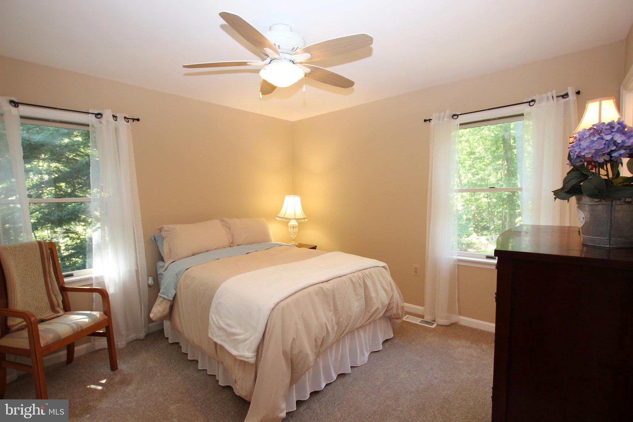 426 Mad Hatter Road Harpers Ferry, WV 25425 - Photo 21 of 31 a bedroom with a bed and a large window