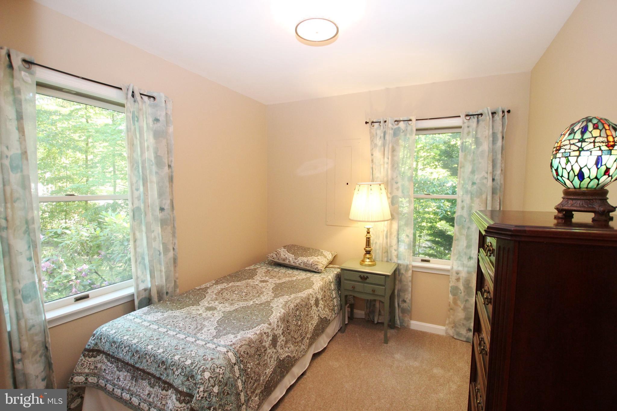 426 Mad Hatter Road Harpers Ferry, WV 25425 - Photo 24 of 31 a bedroom with a bed and a window