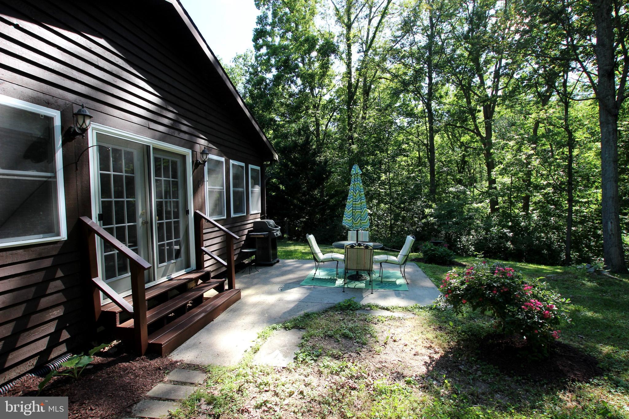 426 Mad Hatter Road Harpers Ferry, WV 25425 - Photo 28 of 31 a view of backyard with deck and outdoor seating