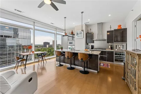 a view of a dining room with furniture window and wooden floor