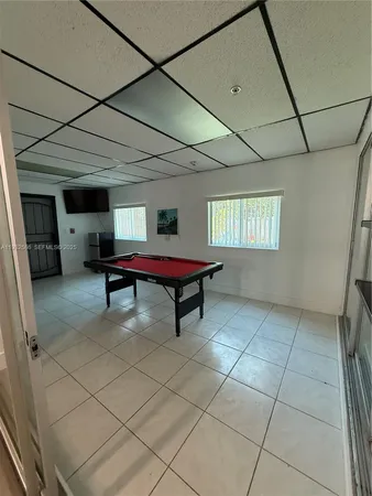 a lobby with furniture and window