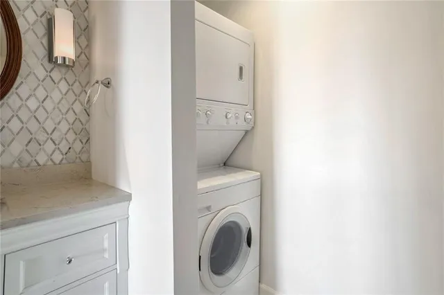 a view of a hallway with washer and dryer