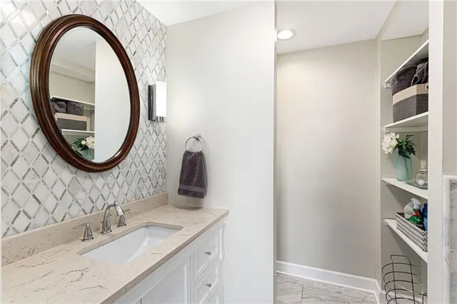 a bathroom with a sink a and a mirror