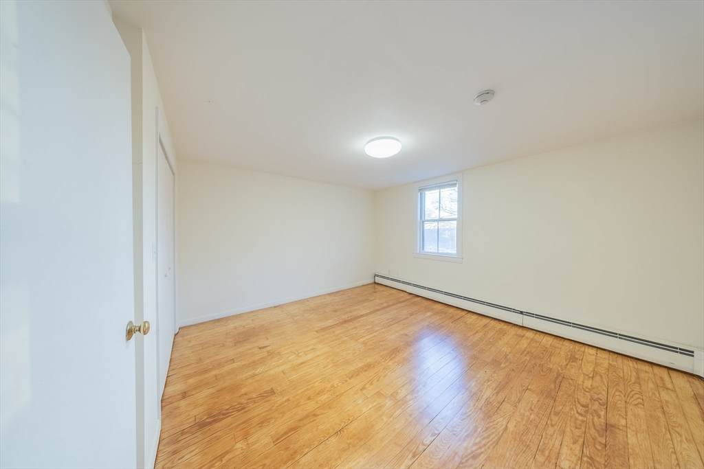 1026 Chestnut Street, Unit 2A Newton, MA 02464 - Photo 15 of 17 a view of an empty room and window