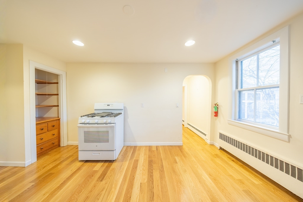 1026 Chestnut Street, Unit 2A Newton, MA 02464 - Photo 5 of 17 a view of a kitchen with a stove top oven