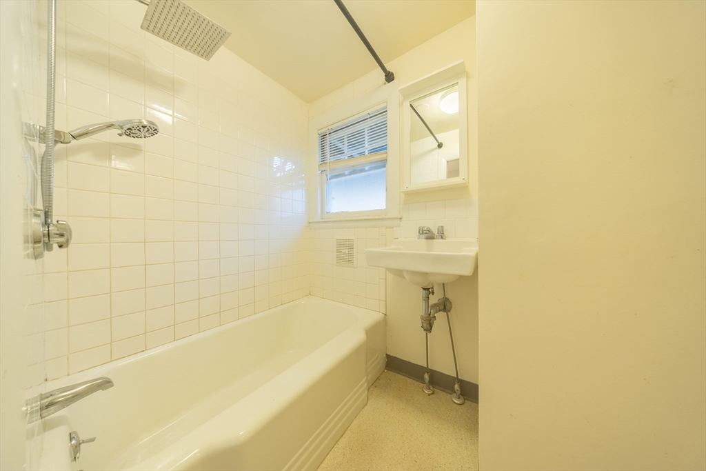 1026 Chestnut Street, Unit 2A Newton, MA 02464 - Photo 6 of 17 a bathroom with a bathtub and shower