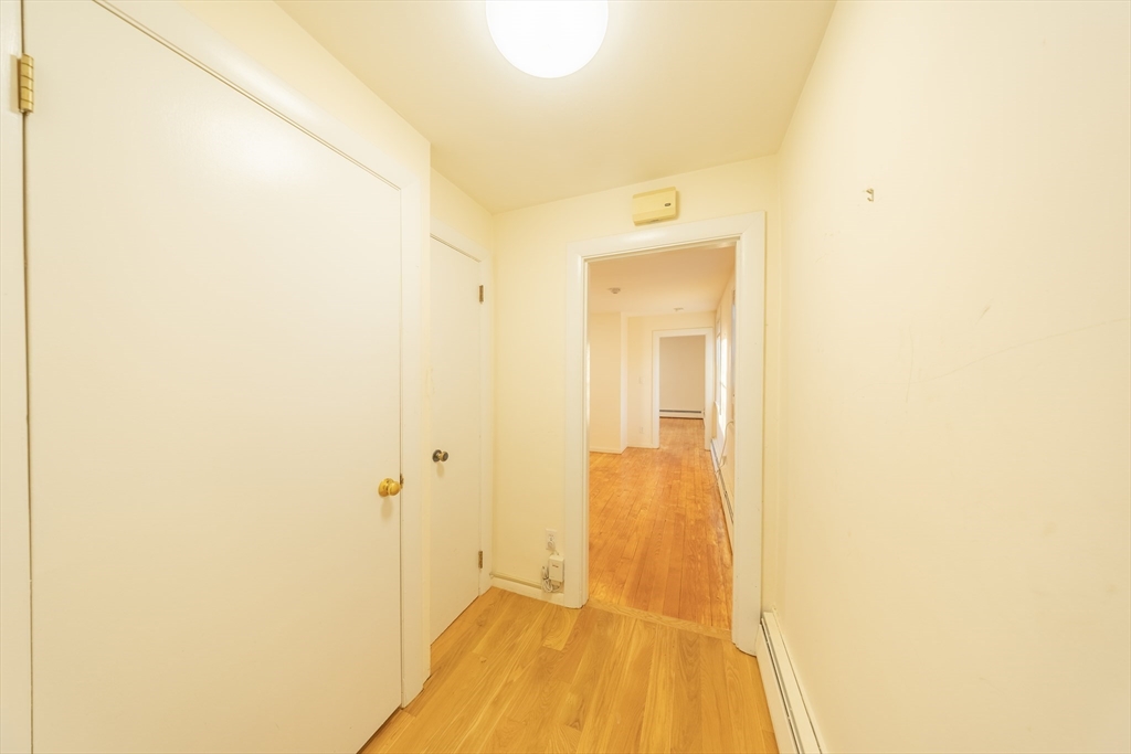 1026 Chestnut Street, Unit 2A Newton, MA 02464 - Photo 8 of 17 a view of a bathroom with a shower and a sink