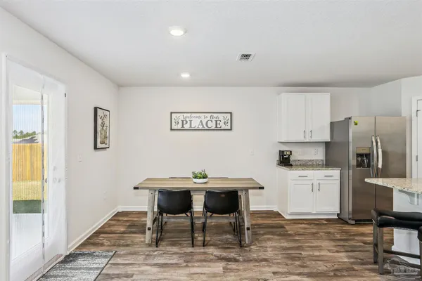 a view of a dining room with furniture