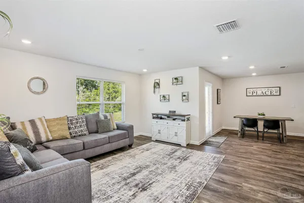 a living room with furniture and a table