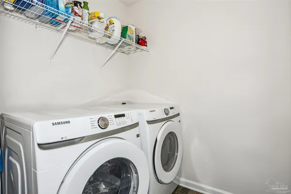 a utility room with dryer and washer