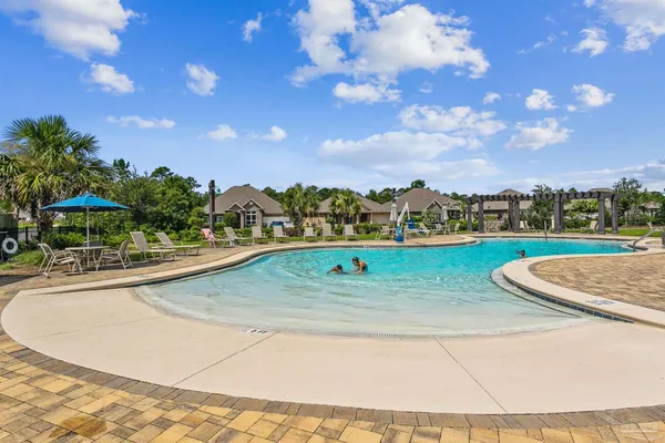 a view of a swimming pool and an outdoor space