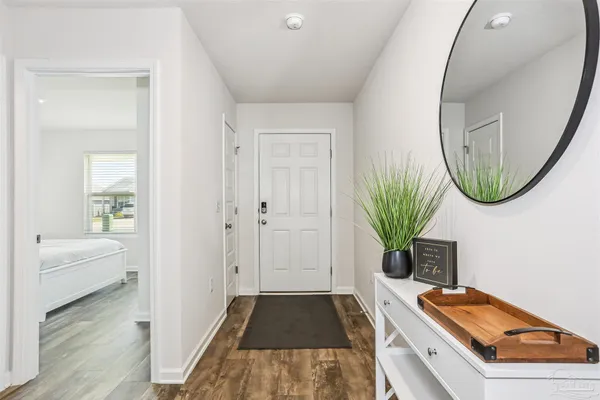 a room with furniture and a potted plant