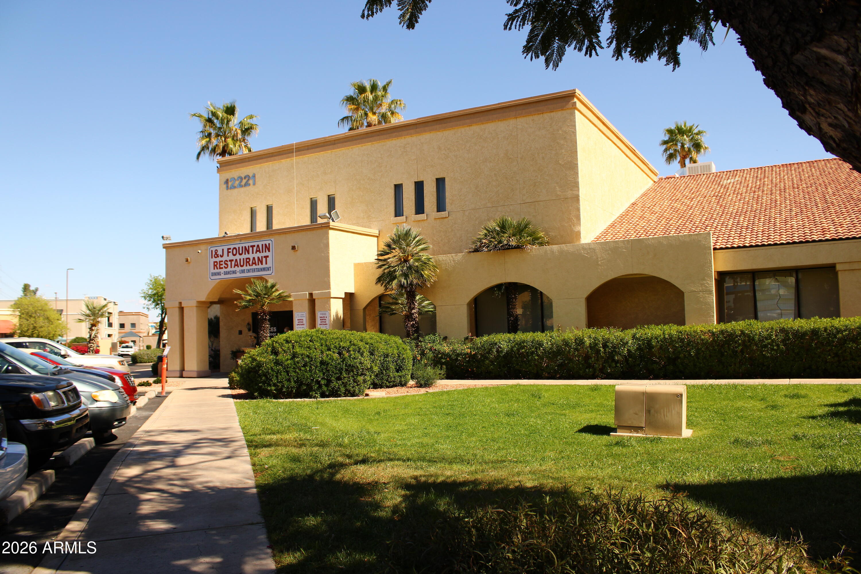12221 West Bell Road, Unit 182 Surprise, AZ 85378 - Photo 1 of 10 a front view of a house with a yard