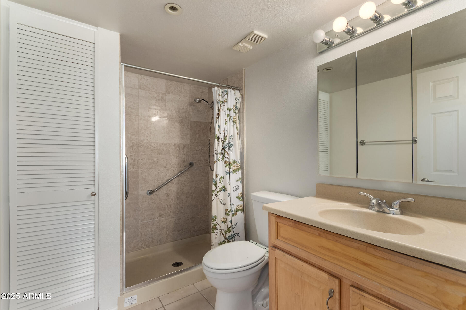 7850 East Camelback Road, Unit 101 Scottsdale, AZ 85251 - Photo 14 of 26 a bathroom with a granite countertop sink toilet and shower