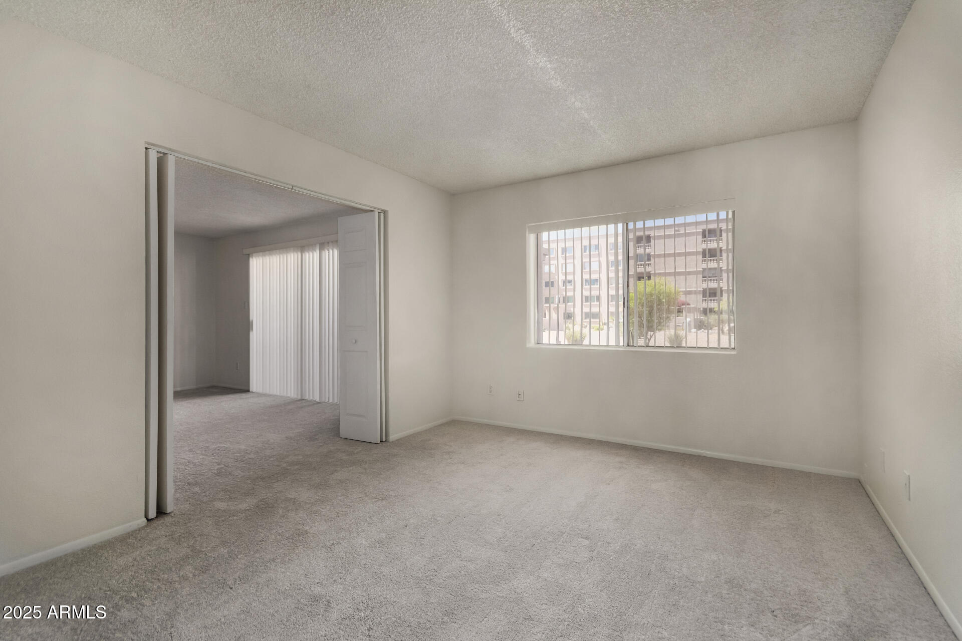 7850 East Camelback Road, Unit 101 Scottsdale, AZ 85251 - Photo 17 of 26 an empty room with windows