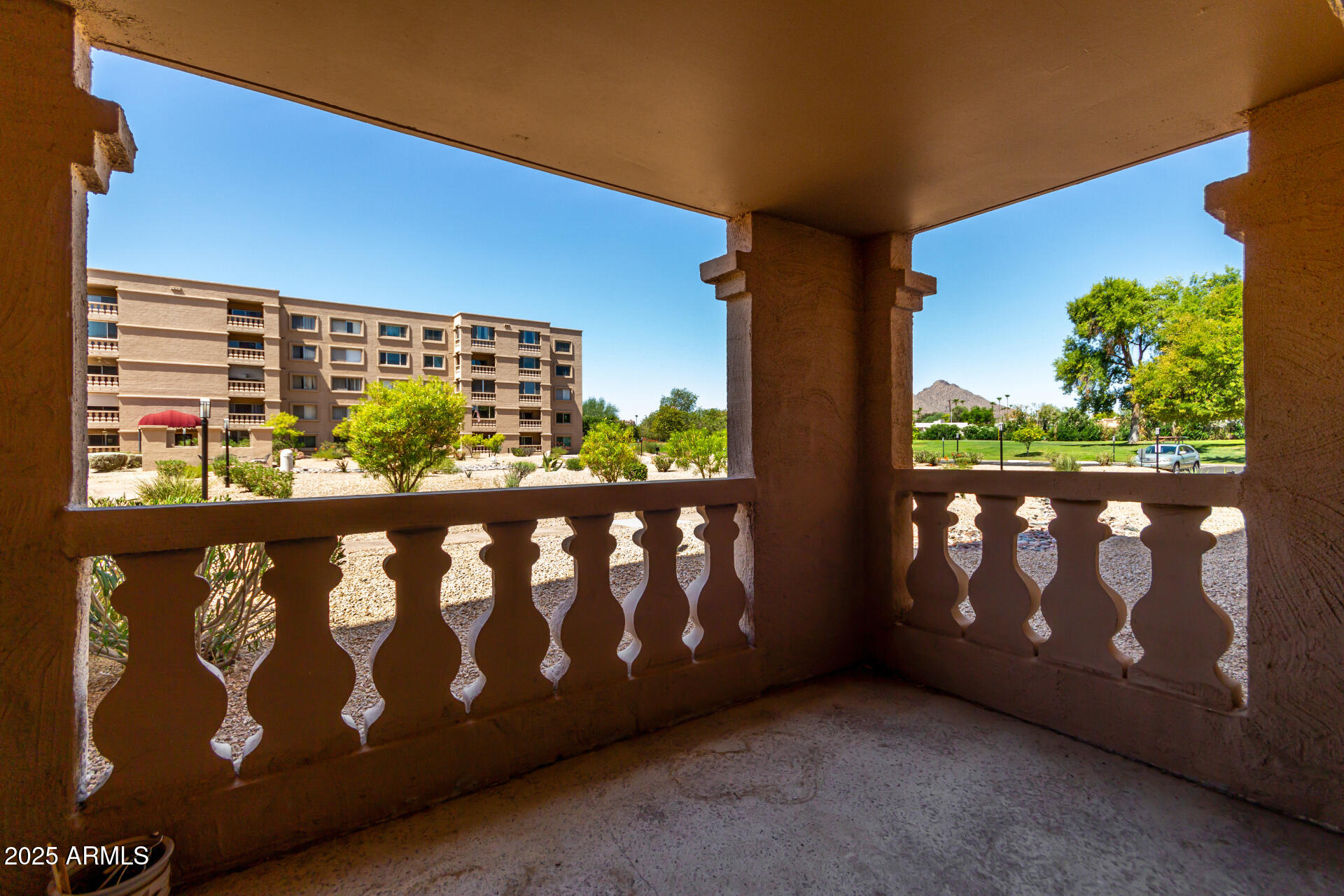 7850 East Camelback Road, Unit 101 Scottsdale, AZ 85251 - Photo 19 of 26 a view of outdoor space with furniture and garden
