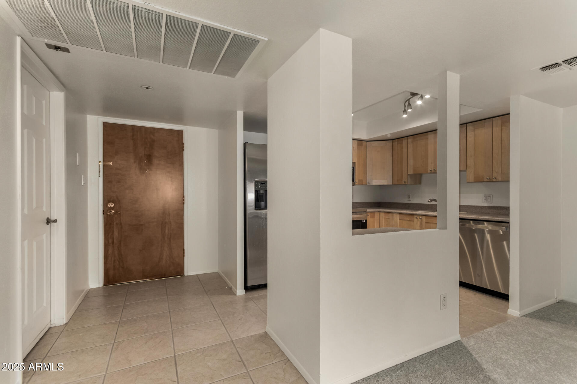 7850 East Camelback Road, Unit 101 Scottsdale, AZ 85251 - Photo 9 of 26 a view of kitchen with refrigerator and window