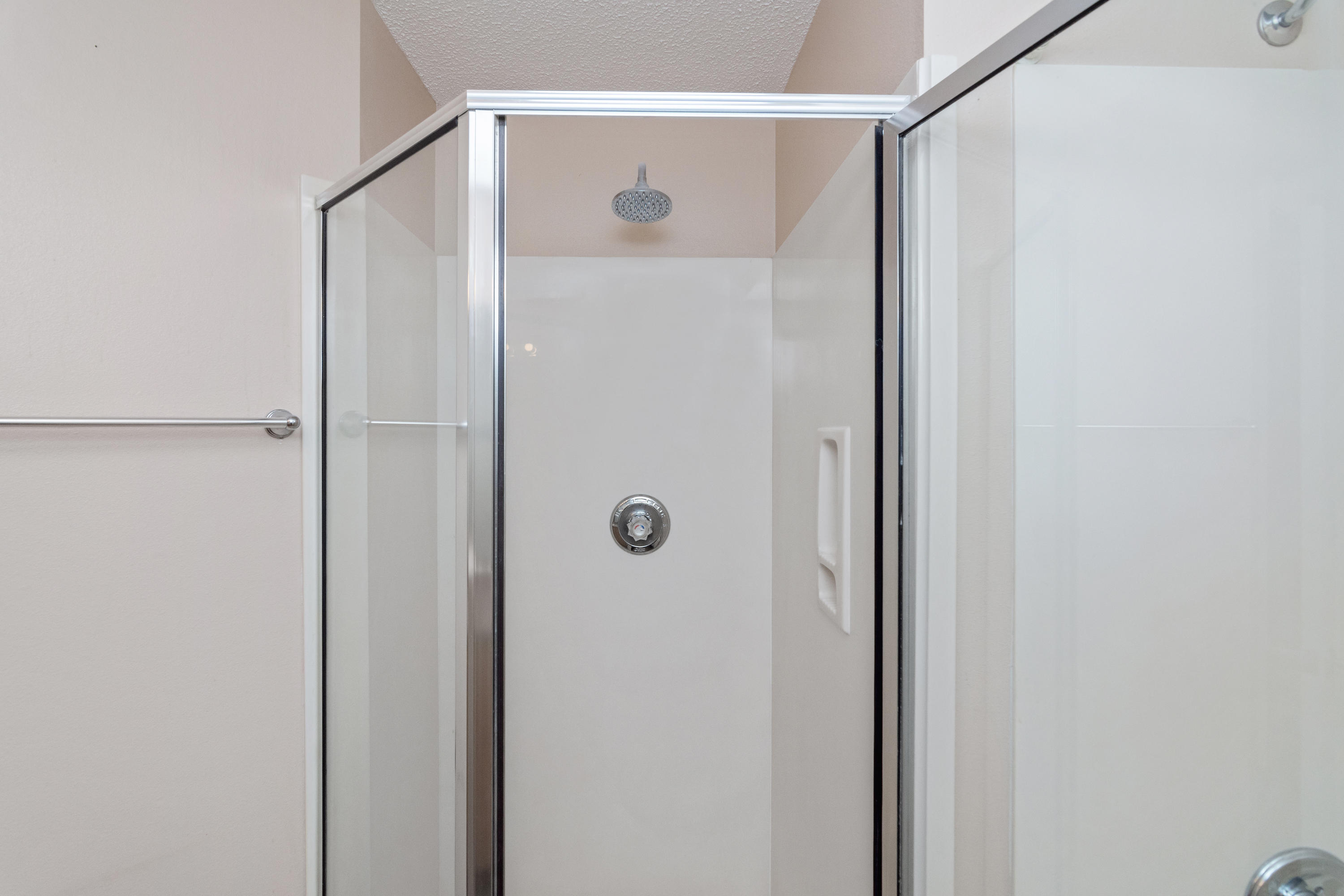 3811 Poverty Creek Road Crestview, FL 32539 - Photo 15 of 48 a bathroom with a glass shower door