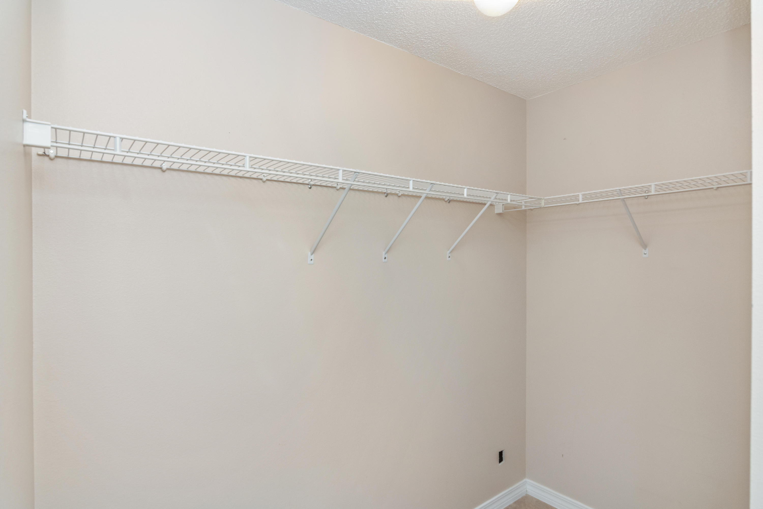 3811 Poverty Creek Road Crestview, FL 32539 - Photo 17 of 48 a view of a room with racks on the wall