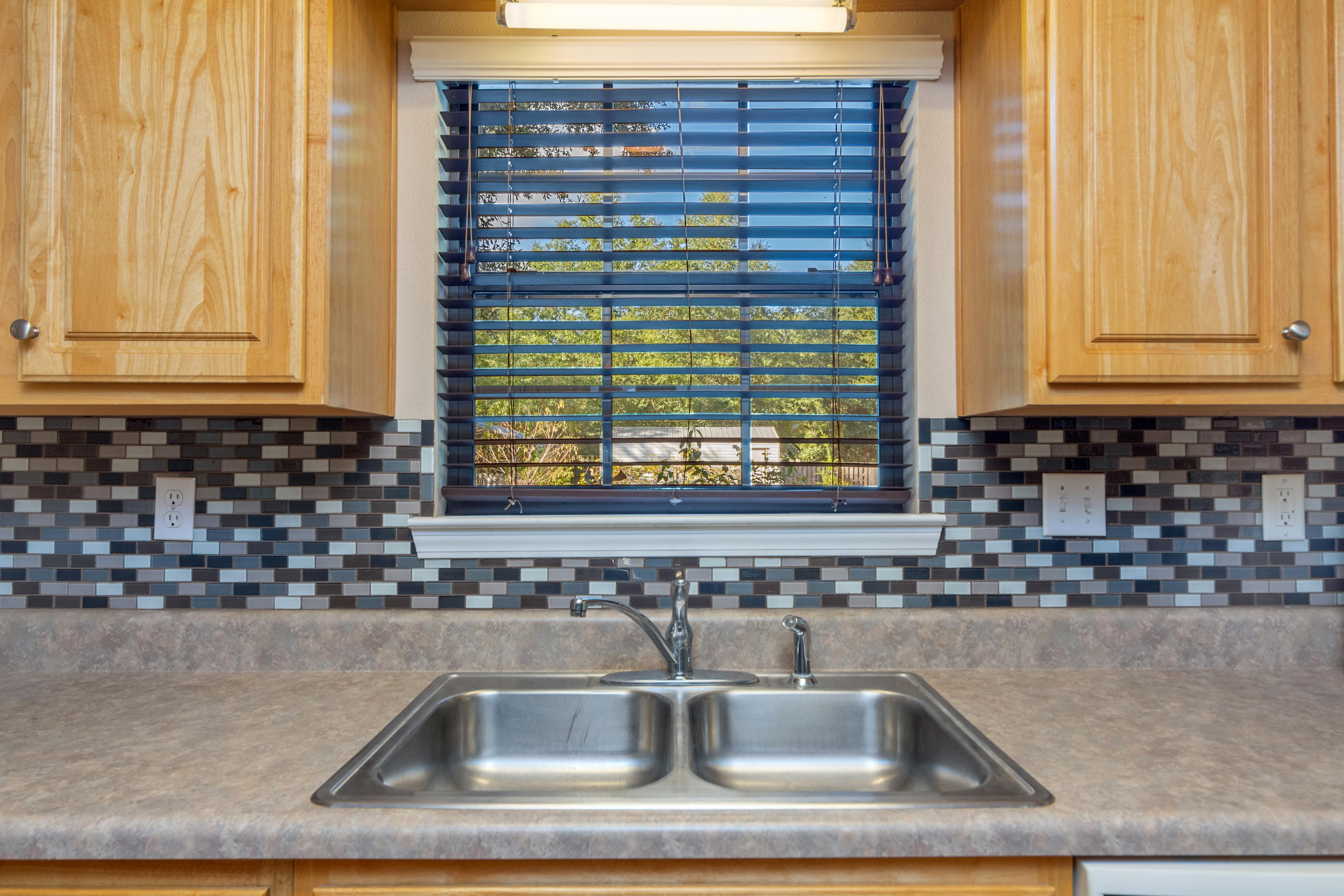 3811 Poverty Creek Road Crestview, FL 32539 - Photo 23 of 48 a kitchen with a sink and a window