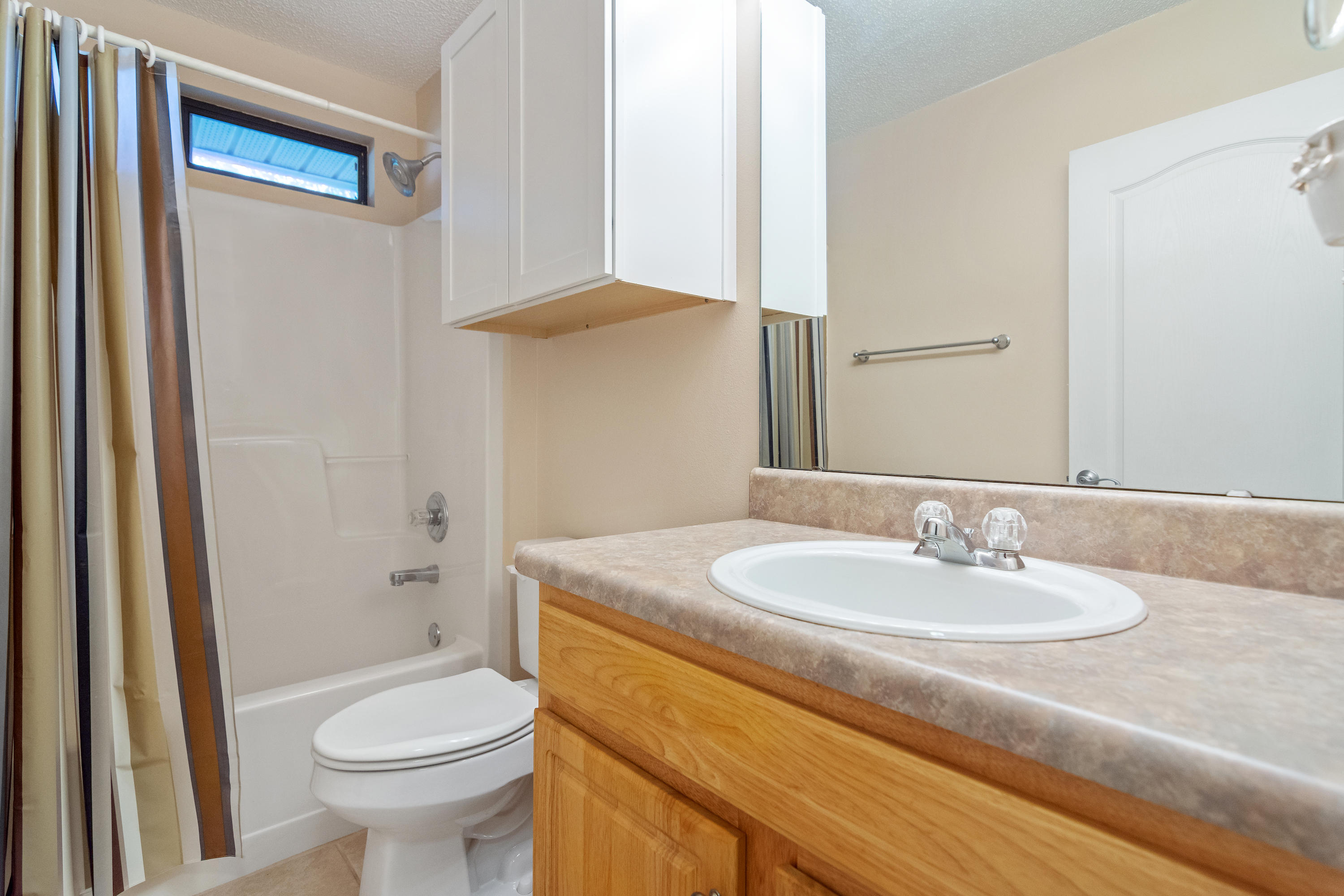 3811 Poverty Creek Road Crestview, FL 32539 - Photo 32 of 48 a bathroom with a sink toilet and shower