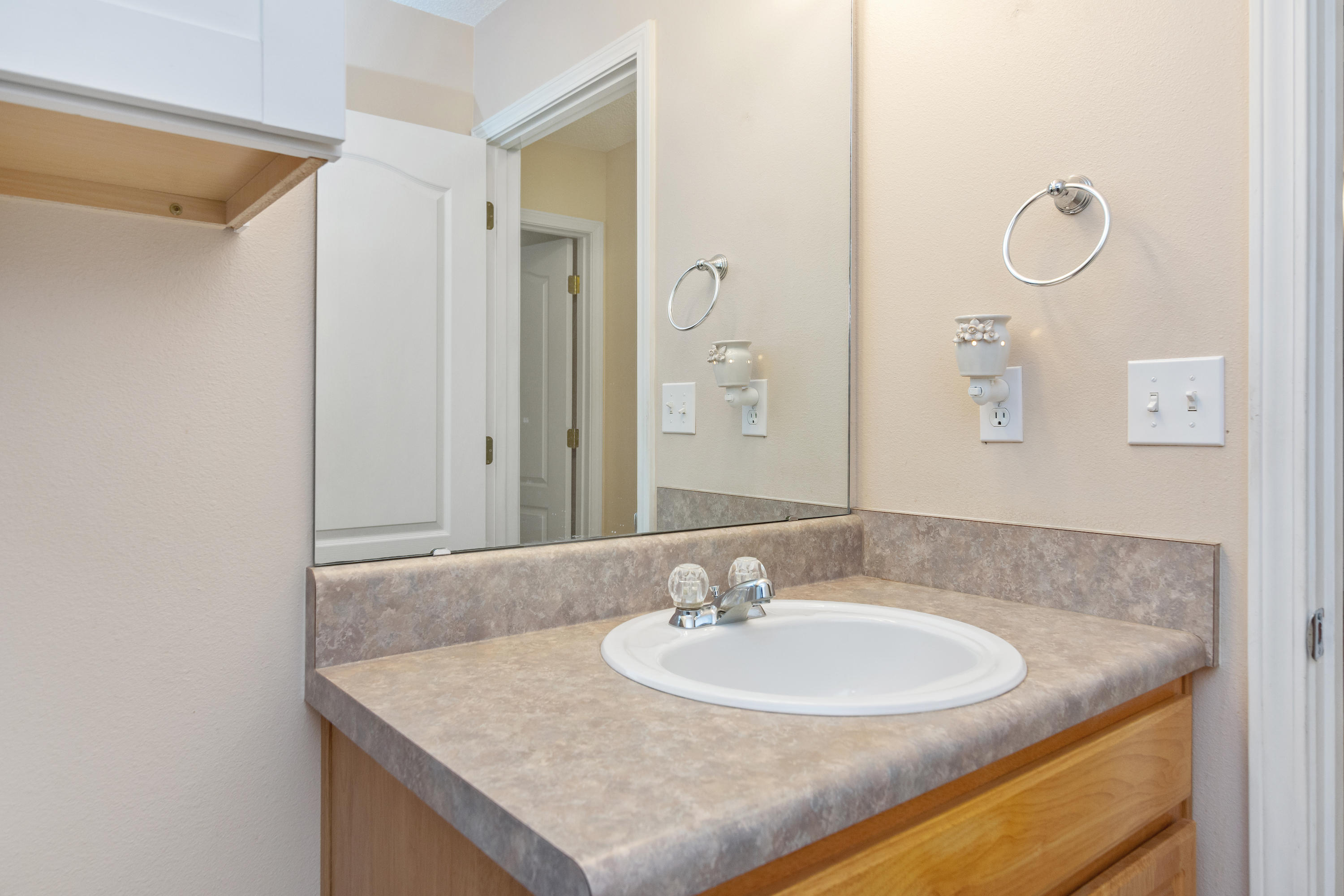 3811 Poverty Creek Road Crestview, FL 32539 - Photo 34 of 48 a bathroom with a sink and a mirror