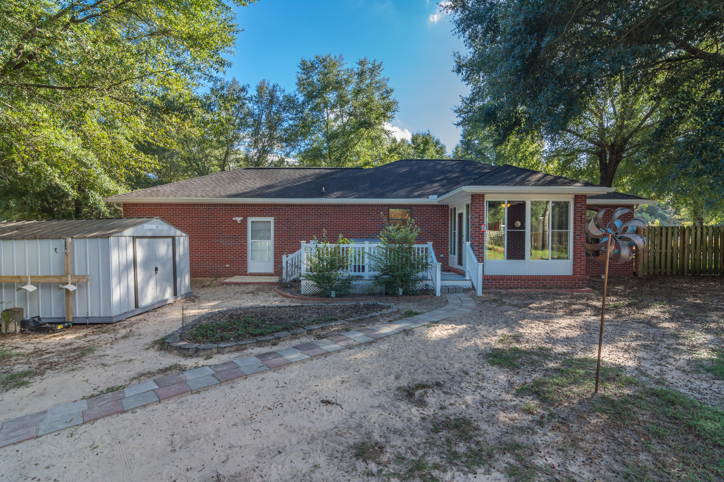3811 Poverty Creek Road Crestview, FL 32539 - Photo 35 of 48 a view of a house with a yard