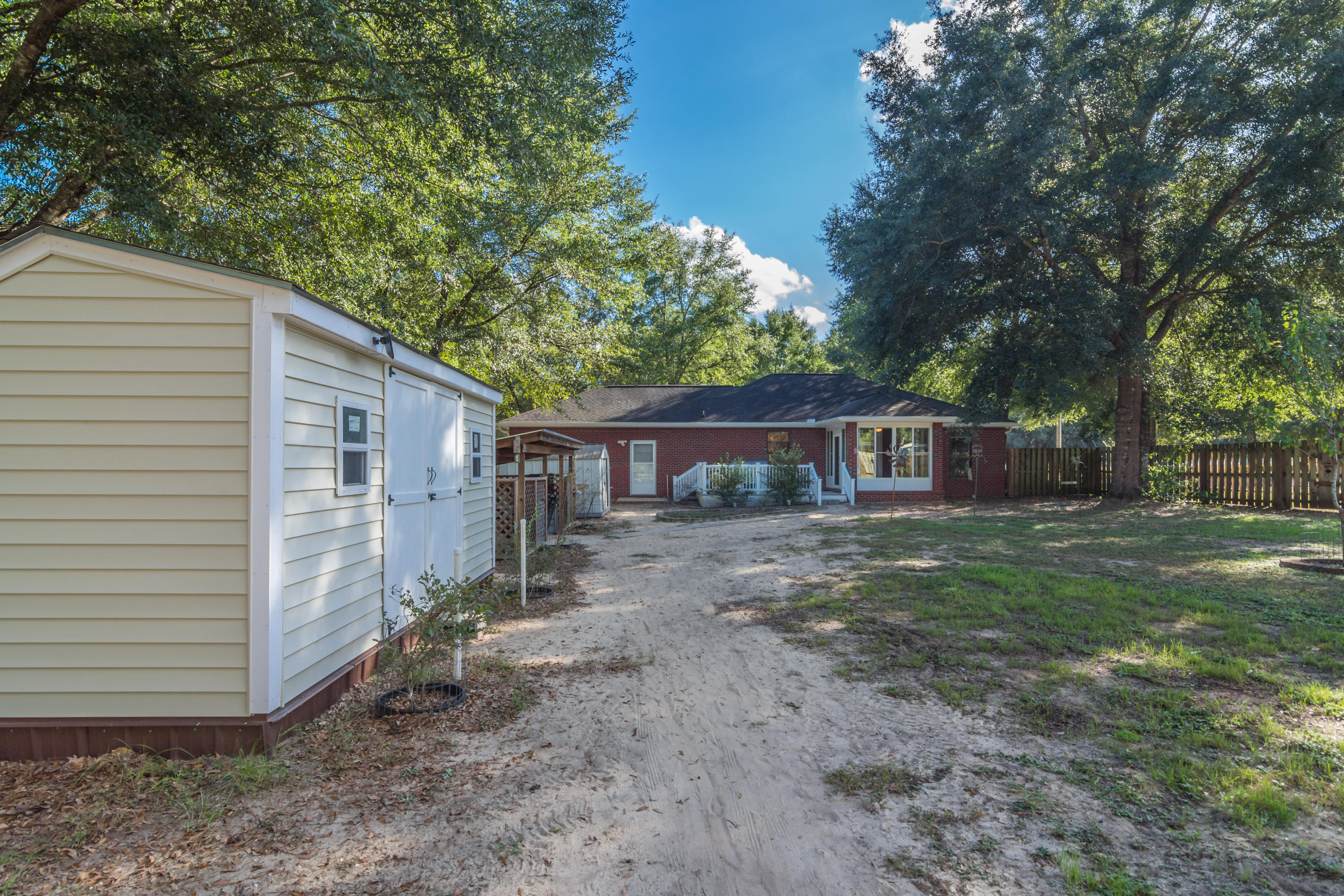 3811 Poverty Creek Road Crestview, FL 32539 - Photo 39 of 48 a view of a house with a yard