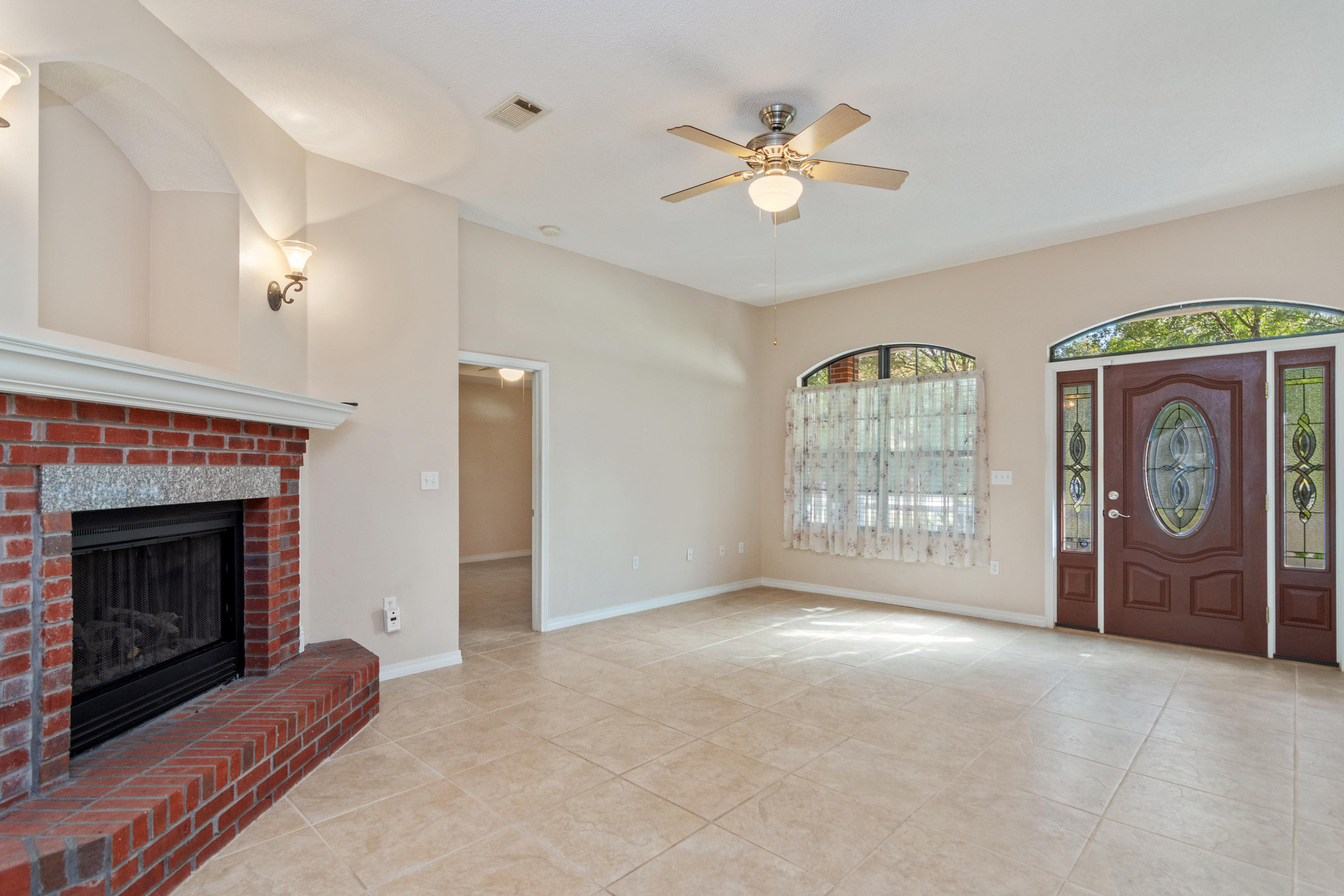 3811 Poverty Creek Road Crestview, FL 32539 - Photo 6 of 48 a view of an empty room with a fireplace