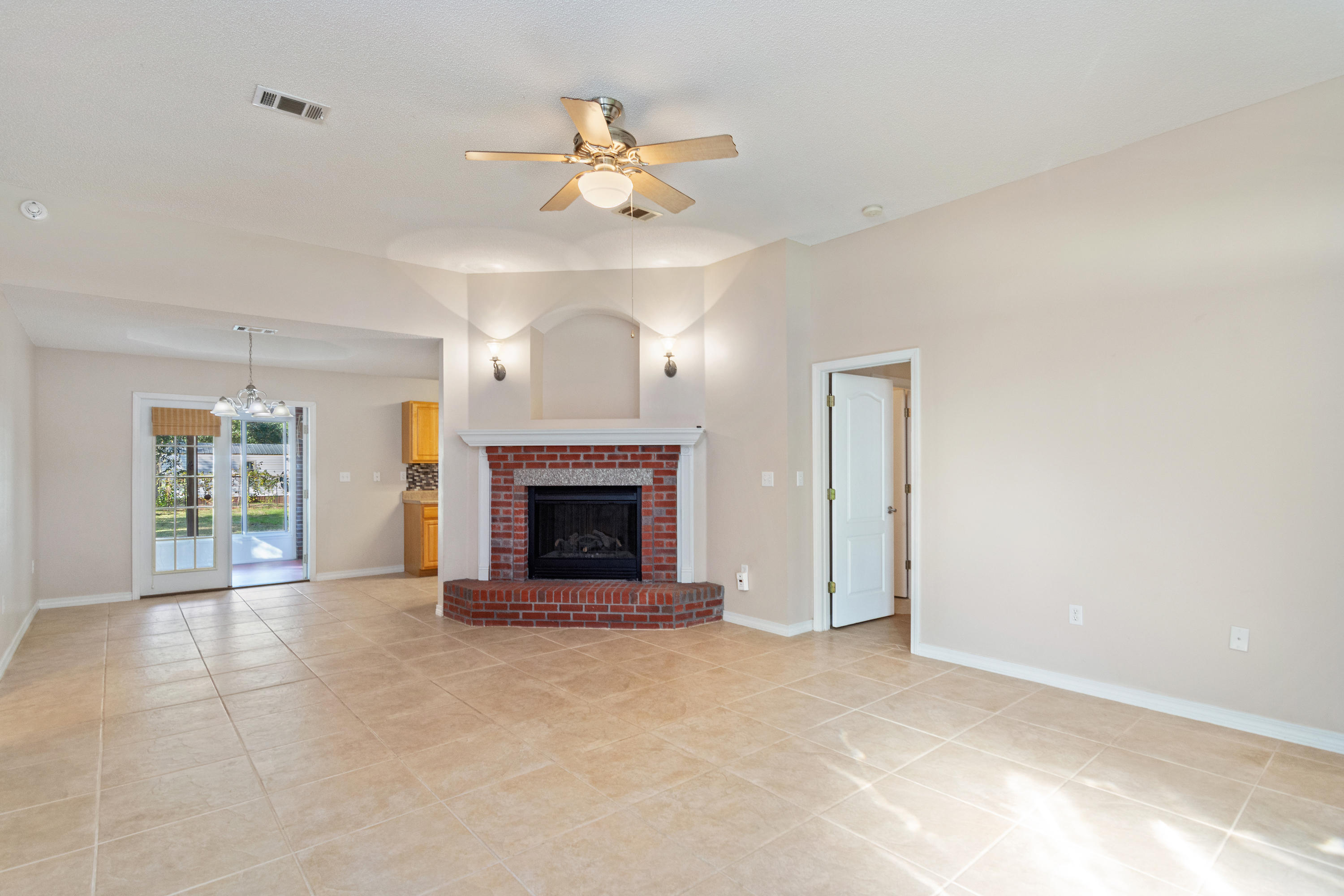 3811 Poverty Creek Road Crestview, FL 32539 - Photo 8 of 48 a view of an empty room with a fireplace